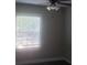 A bedroom with a window, and a ceiling fan at 2835 Burton Rd, Atlanta, GA 30311