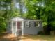 A single story home with gray siding and a small front porch at 2835 Burton Rd, Atlanta, GA 30311