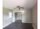 A living room with gray walls and a view into another room at 2835 Burton Rd, Atlanta, GA 30311