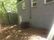 A side yard with gray siding and an air conditioning unit at 2835 Burton Rd, Atlanta, GA 30311