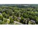 Aerial view of the neighborhood showcasing the home surrounded by lush greenery at 5600 Surrey Ct, Alpharetta, GA 30009