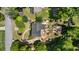 Aerial view of the property showcasing the house, landscaping, backyard, and surrounding neighborhood at 5600 Surrey Ct, Alpharetta, GA 30009