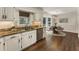 Kitchen featuring granite counters, stainless appliances, and a view into the eat in area at 5600 Surrey Ct, Alpharetta, GA 30009