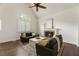 Bright living room features vaulted ceilings, hardwood floors, modern decor, and a cozy fireplace at 5600 Surrey Ct, Alpharetta, GA 30009