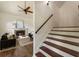 Cozy living room with a fireplace, hardwood floors, and staircase at 5600 Surrey Ct, Alpharetta, GA 30009