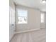 Bedroom featuring neutral walls, carpet, and two windows for natural light at 5627 Meadowstone Walk, Kennesaw, GA 30152