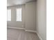 Well lit bedroom featuring neutral walls, carpet, and two windows for natural light at 5627 Meadowstone Walk, Kennesaw, GA 30152