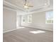 Spacious main bedroom featuring carpeted floors, large windows and tray ceiling at 5627 Meadowstone Walk, Kennesaw, GA 30152