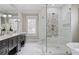 Elegant bathroom boasts double vanities, a glass enclosed shower, and a soaking tub for relaxation at 2908 Mabry Ne Ln, Brookhaven, GA 30319
