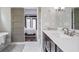 Bright bathroom with a double vanity, modern fixtures, and a view to the bedroom at 2908 Mabry Ne Ln, Brookhaven, GA 30319
