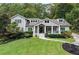 Charming two-story home with a well-manicured lawn, beautiful landscaping, and a welcoming front porch at 2908 Mabry Ne Ln, Brookhaven, GA 30319