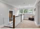 Bright hallway featuring a safety gate and large windows that provide a wealth of natural light at 2908 Mabry Ne Ln, Brookhaven, GA 30319