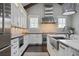 Well-lit kitchen with white cabinets, stainless steel appliances, and farmhouse sink at 2908 Mabry Ne Ln, Brookhaven, GA 30319