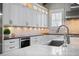 Bright kitchen featuring white cabinets, sleek appliances, and elegant countertops at 2908 Mabry Ne Ln, Brookhaven, GA 30319