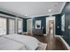 Spacious main bedroom with dark walls, hardwood floors, and elegant furnishings at 2908 Mabry Ne Ln, Brookhaven, GA 30319