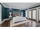 Serene main bedroom with elegant furnishings, hardwood floors and natural light from the french doors at 2908 Mabry Ne Ln, Brookhaven, GA 30319