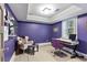 Stylish home office with purple walls, modern desk, comfortable chair, and natural light from the window at 2908 Mabry Ne Ln, Brookhaven, GA 30319