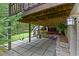 Spacious patio features stone pavers with stairs to a lush backyard with a swing set at 2908 Mabry Ne Ln, Brookhaven, GA 30319