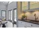 Stylish wet bar with herringbone backsplash and access to patio at 2908 Mabry Ne Ln, Brookhaven, GA 30319