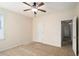 Neutral bedroom featuring a ceiling fan, carpet, a closet, and a view of the hallway at 3634 Cape Ln, Conyers, GA 30013
