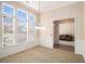 Bright dining room with carpeted floor, wainscoting, and large windows provides ample natural light at 3634 Cape Ln, Conyers, GA 30013