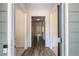 Hallway features wood flooring, neutral walls, and classic trim, offering a bright and welcoming entrance at 3634 Cape Ln, Conyers, GA 30013