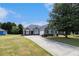 Attractive single-Gathering home featuring lush green lawn, long driveway and a well-maintained exterior at 3634 Cape Ln, Conyers, GA 30013