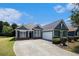 Charming home with a well-manicured lawn, long driveway, attached garage, and inviting curb appeal at 3634 Cape Ln, Conyers, GA 30013