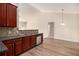 Kitchen with wood cabinets, stainless steel dishwasher, and ample counter space perfect for cooking at 3634 Cape Ln, Conyers, GA 30013