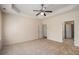 Large main bedroom features a tray ceiling and access to the en suite bath at 3634 Cape Ln, Conyers, GA 30013