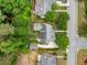 Aerial view of a home in a verdant neighborhood featuring mature trees, manicured lawns, and quiet streets at 450 Bay Grove Se Rd, Loganville, GA 30052