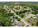 Residential neighborhood with tree-lined streets, manicured lawns, and various home styles at 450 Bay Grove Se Rd, Loganville, GA 30052