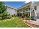Sprawling backyard with lush landscaping, a patio, and a two-story deck, perfect for outdoor living at 450 Bay Grove Se Rd, Loganville, GA 30052