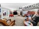 Expansive basement with sports decor, theater-style seating, and ample entertainment space at 450 Bay Grove Se Rd, Loganville, GA 30052