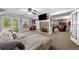 Open-concept basement featuring a stone fireplace, comfortable seating, and walk-out to the backyard at 450 Bay Grove Se Rd, Loganville, GA 30052