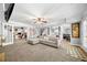 Entertainer's basement with an open floor plan that connects the living area, office, and kitchen at 450 Bay Grove Se Rd, Loganville, GA 30052