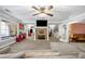 Spacious basement with stone fireplace, gray couch, and open layout for entertaining at 450 Bay Grove Se Rd, Loganville, GA 30052