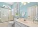 Light-filled bathroom with shower/tub combo, single sink vanity, and a window with blinds at 450 Bay Grove Se Rd, Loganville, GA 30052