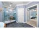 Elegant bathroom featuring a glass shower, modern fixtures, and stylish tile flooring with a door leading to the main bedroom at 450 Bay Grove Se Rd, Loganville, GA 30052