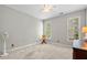 Bright bedroom with neutral walls, natural light, and carpet floors at 450 Bay Grove Se Rd, Loganville, GA 30052