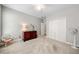 Bright bedroom with neutral walls, carpet floors, and a large closet at 450 Bay Grove Se Rd, Loganville, GA 30052