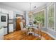 Charming breakfast nook with a glass table, comfortable chairs, and bright natural light for delightful morning meals at 450 Bay Grove Se Rd, Loganville, GA 30052