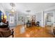 Elegant dining room boasts gleaming hardwood floors, decorative moldings, and ample natural light at 450 Bay Grove Se Rd, Loganville, GA 30052