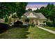 Charming single-Gathering home with manicured lawn, cozy front porch, and well-lit windows at 450 Bay Grove Se Rd, Loganville, GA 30052