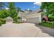 Charming home with a detached garage, mature landscaping, and an American flag at 450 Bay Grove Se Rd, Loganville, GA 30052