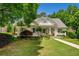 Inviting home with mature trees, manicured lawn, and tasteful landscaping, offering great curb appeal at 450 Bay Grove Se Rd, Loganville, GA 30052
