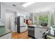 Bright eat-in kitchen area features modern appliances, a bay window, and plenty of natural light at 450 Bay Grove Se Rd, Loganville, GA 30052