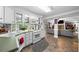 Bright, functional kitchen with white cabinets, ample counter space, and modern appliances, open to the Living Room at 450 Bay Grove Se Rd, Loganville, GA 30052