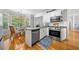 Updated kitchen featuring stainless steel appliances and bay window breakfast nook at 450 Bay Grove Se Rd, Loganville, GA 30052