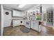Bright, functional kitchen with white cabinets, ample counter space, and modern appliances with view to backyard at 450 Bay Grove Se Rd, Loganville, GA 30052